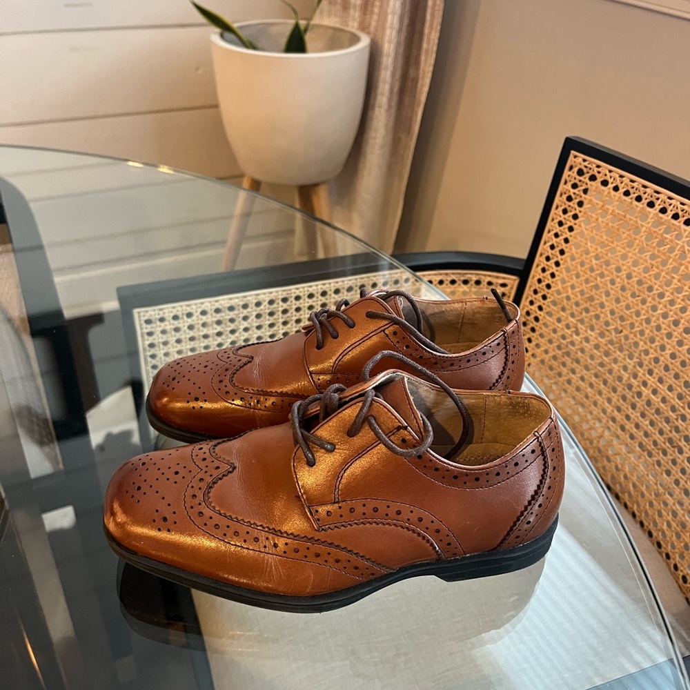 New without tags. Never worn. Boys genuine leather dress shoes.